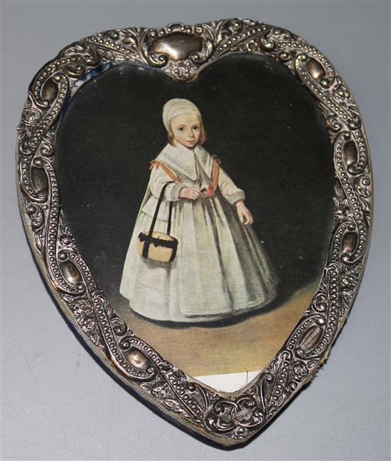 An Edwardian repousse silver mounted heart shaped photograph frame by James Deakin & Sons, Chester, 1901, 6in.
